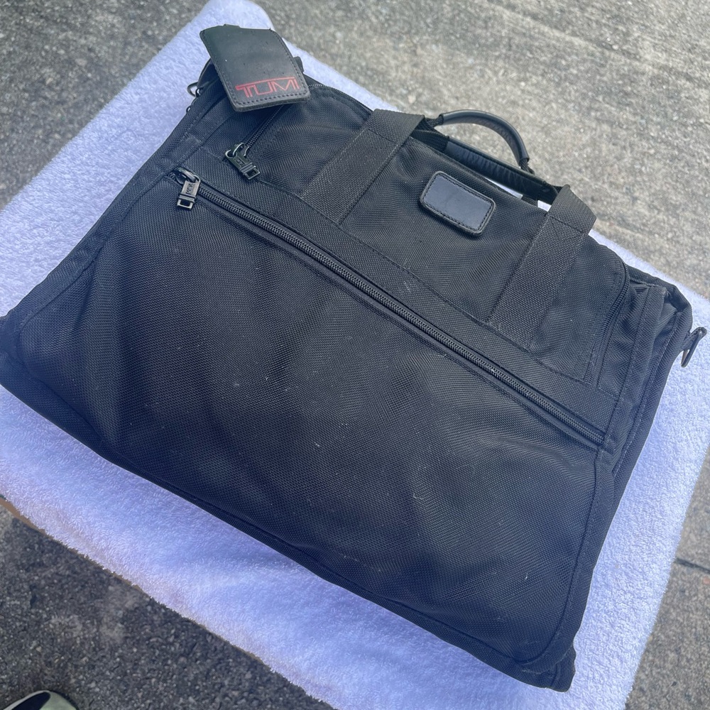 Tumi Black Briefcase with Sleek Design and Durable Ballistic Nylon Material.
